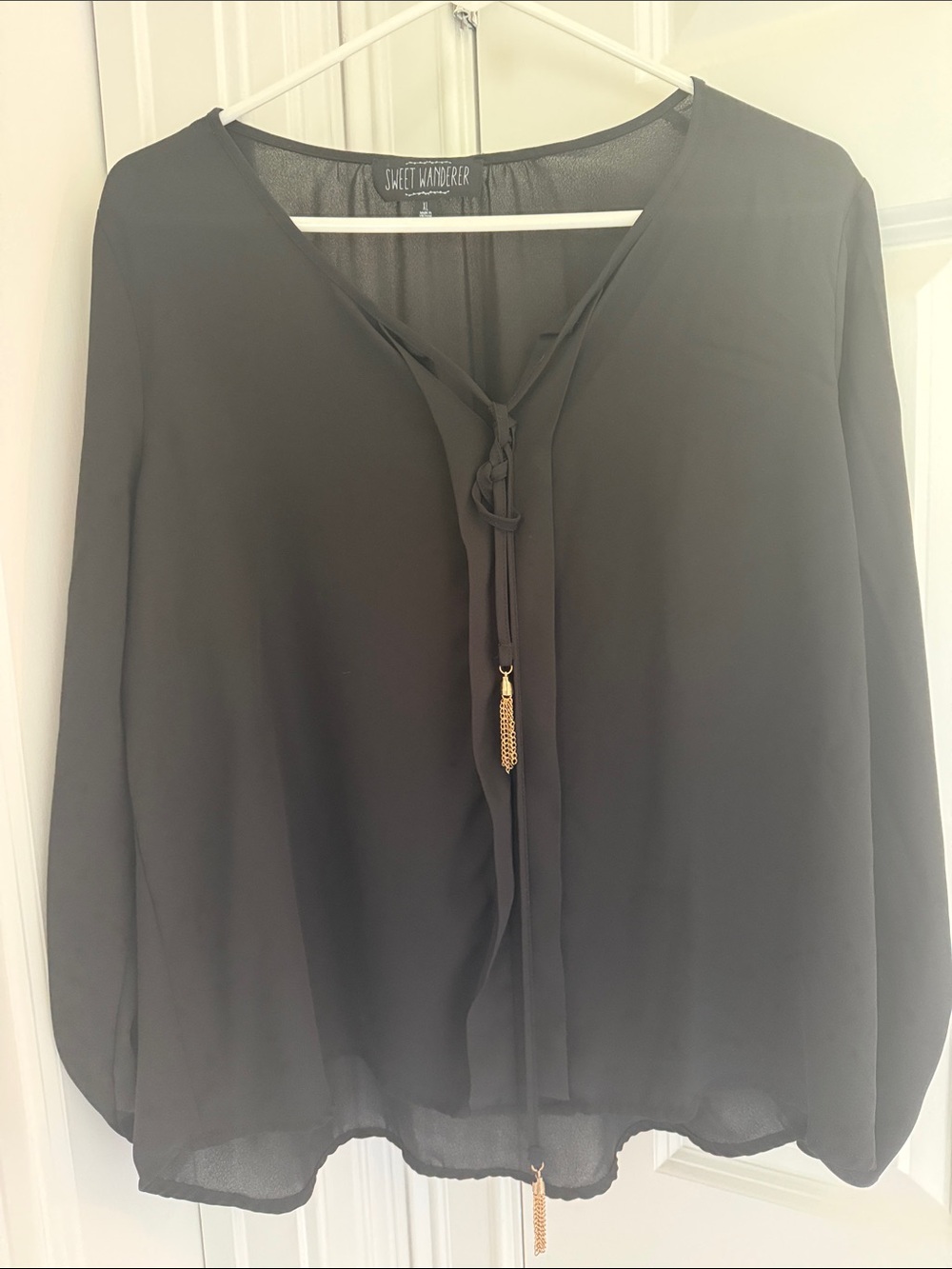 Sweet Wanderer Black Tie-Front Long Sleeve Blouse with Gold Tassel